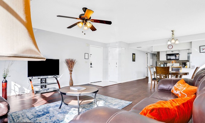 Royal Palm Bay Condo | Sunflower-yellow condo with pool, W/D, hot tub & kitchen - dog/snowbird-friendly