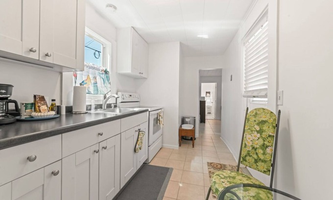 Parrot Cove House | Sunny 2-bedroom Beach Bungalow in Lake Worth Beach just steps from the ocean!
