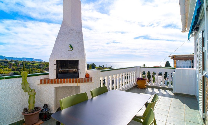 Oasis del Capistrano Apartment | Sunny Terrace Chimenea by Casasol