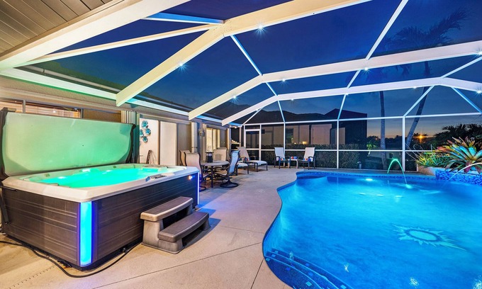 Caloosahatchee House | Sunset Canal - Waterfront Luxury, Heated Salt Pool, Dock, Kayaks, Bikes & Golf