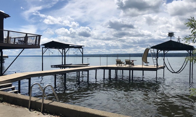 Town of Ledyard Cottage | Sunset Haven, lakefront on Cayuga Lake w/ Hot Tub, Waterslide & Boat Lift