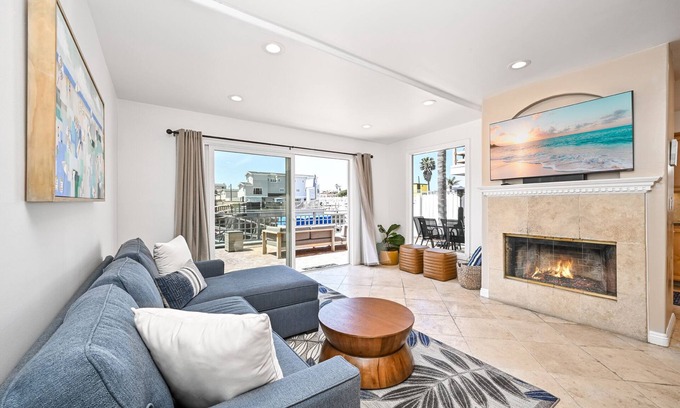 Sunset Beach House | Sunset Island Waterfront Home with Kayaks across the Street from the Beach