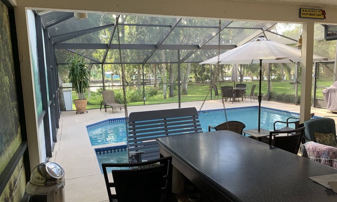 Riverview House | Tampa area home with solar-heated pool, hot tub, river and large dock.
