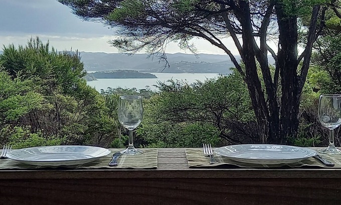 Russell House | Te Oneroa Hill, 5 acres of native park with wonderful sea view.