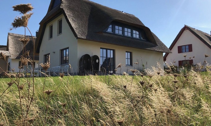 Gross Schwansee House | Thatched-roof house Coastline with sauna & fireplace - the perfect break from everyday life!