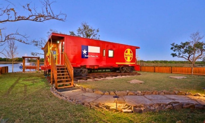 Baird House | The Belle Plain Caboose is a private romatic stay with great fishing!