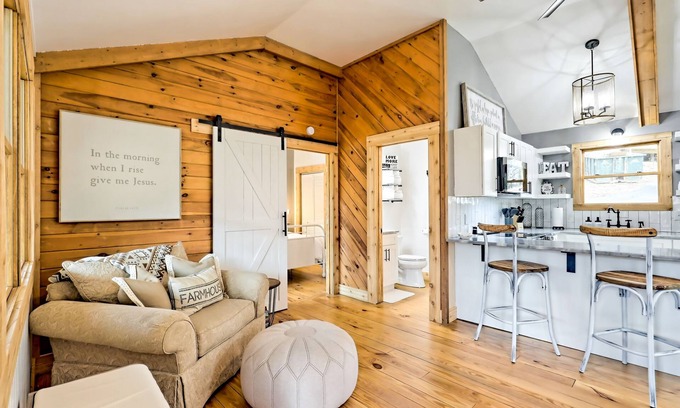 Blairsville Cabin | The Coop | Woodland cabin in Blairsville with wraparound porch & fireplace