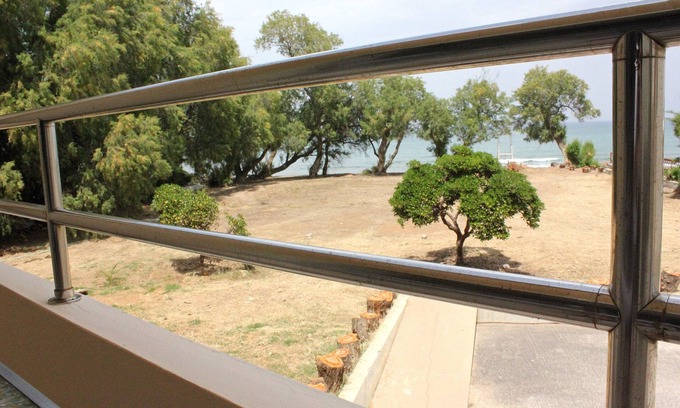 Kato Stalos Apartment | The "LifeGuard" Seafront Luxury Flat, 15meters from beach!
