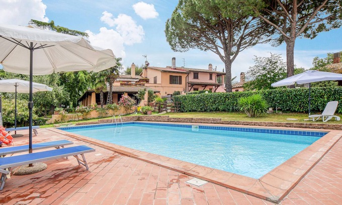 Scansano House | This simply furnished vacation home impresses with its outdoor areas.