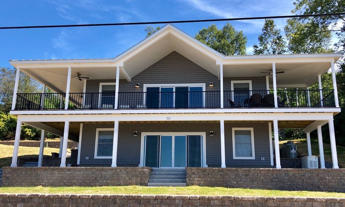 Mid-Coast and Islands House | This spacious home offers a FANTASTIC covered porch, perfect to spend your days gazing at the ocean!