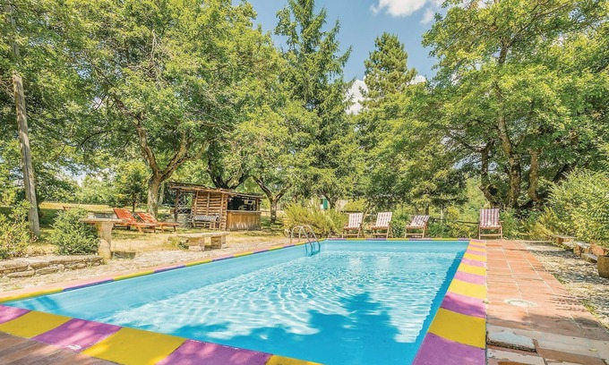 Apecchio House | This vacation home, a former farmhouse, is surrounded by lush woods and is located on a 20-hectare p