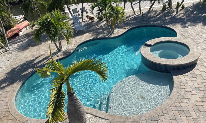 Fort Myers Beach House | Times Square Gem! 4BR Canal front home, private Pool/Spa, Sleeps 12