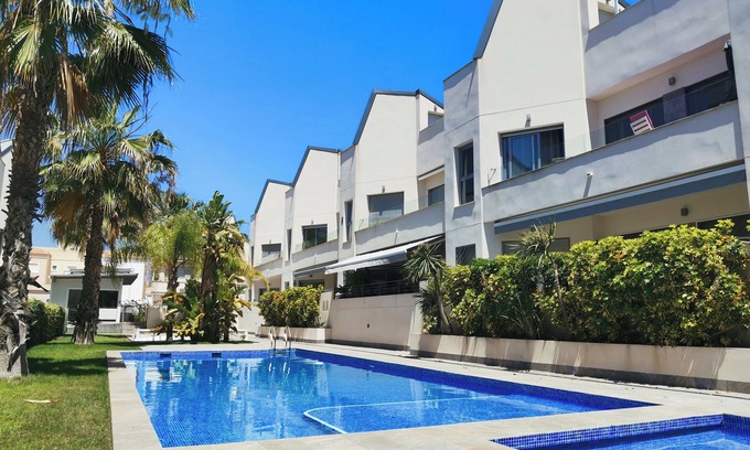 Torrevieja Apartment | Top floor apartment with sunny roof terrace, heated pool and garden