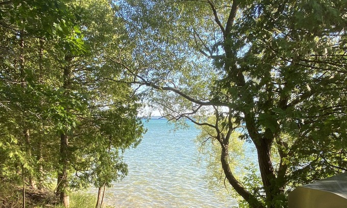 Alden House | Torch Lake Log Cabin, optional Malibu boat rental. Book now August specials!