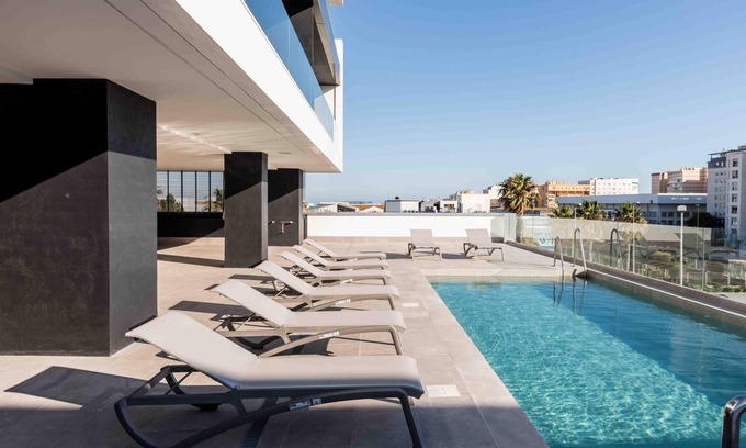 Cadiz Apartment | Torre Dárenas, Victoria beach, swimming pool, gymnasium and parking lot