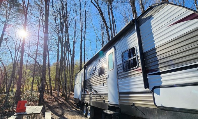 Mill Spring House | Travel trailer near the creek, short walk to pool and playground, indoor and outdoor kitchenette, sleeps 8.