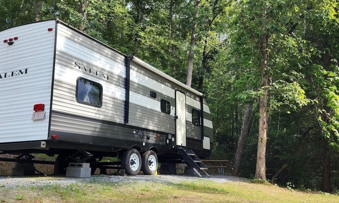 Mill Spring House | Travel trailer near the creek, short walk to pool and playground, sleeps 8.
