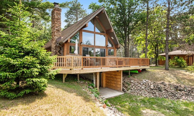Nekoosa House | Tree-surrounded cabin with lake views, kayaks, wood-burning fireplace, & W/D