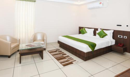 Polibetta Hotel | Treebo Durga Boji Grand, Gonikoppal Town