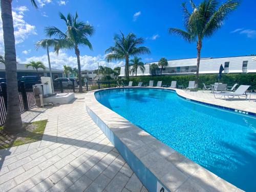 Singer Island Apartment | Tropical Oasis by the beach and shops, with pool