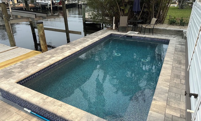 Matlacha House | Tropical Oasis Pool Kayak Bikes fish from dock