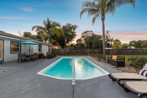 Clearwater House | Tropical Retreat with Heated Pool & Firepit