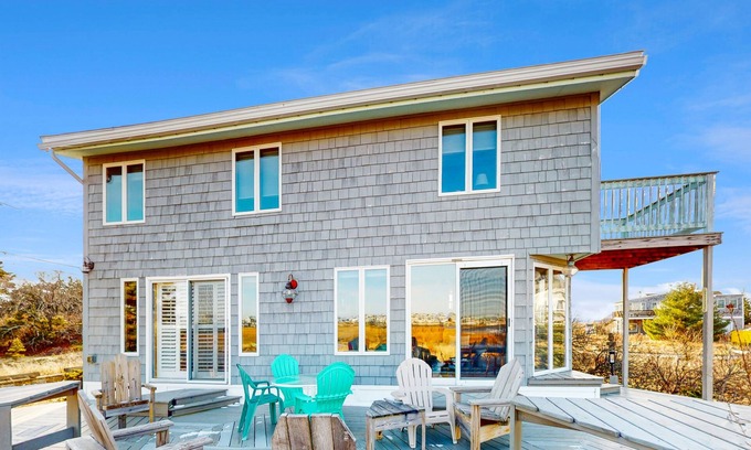 Newbury House | Two-story riverfront retreat with a furnished deck, views, & washer/dryer