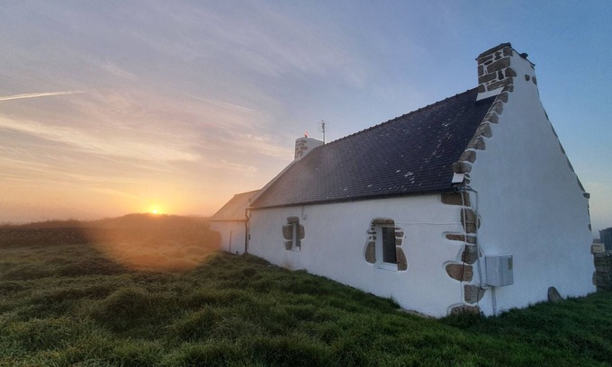 Ushant House | Typical Ouessantine house entirely renovated with its enclosed garden planted with trees.