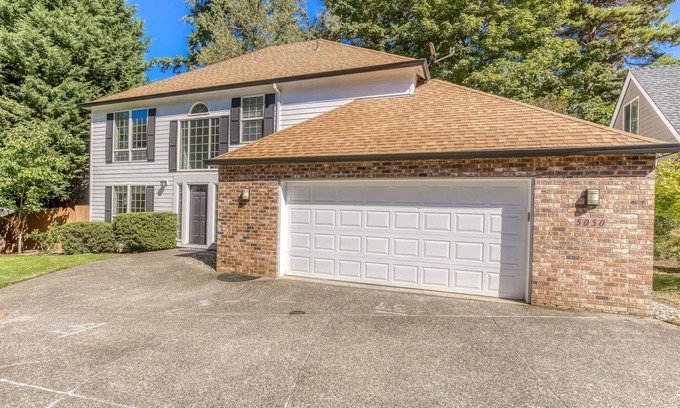 Raleigh Hills House | Updated home next to a park with fenced yard, deck, grill, & W/D