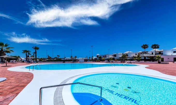 Costa Teguise Apartment | Vacation Apartment 'Casa Yare, Shared Pool, Air-con' with Sea View, Wi-Fi and Air Conditioning