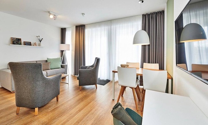 Bensersiel Apartment | Vacation apartment close to the beach with large balcony incl. use of swimming pool & sauna -
