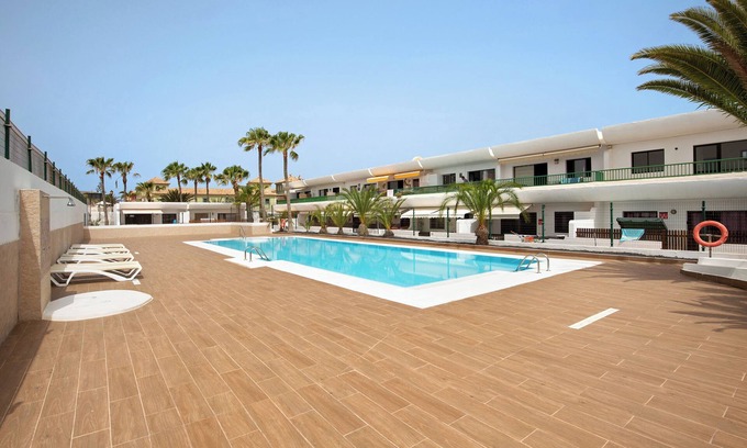 Corralejo Apartment | Vacation Apartment 'Dunes To Explore and Relax' with Shared Pool, Private Terrace and Wi-Fi