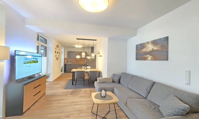 Norden Apartment | Vacation apartment Meeresrauschen on the first floor with garden, sauna and pet