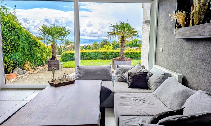 Daisendorf Apartment | Vacation apartment with a view of Lake Constance under palm trees