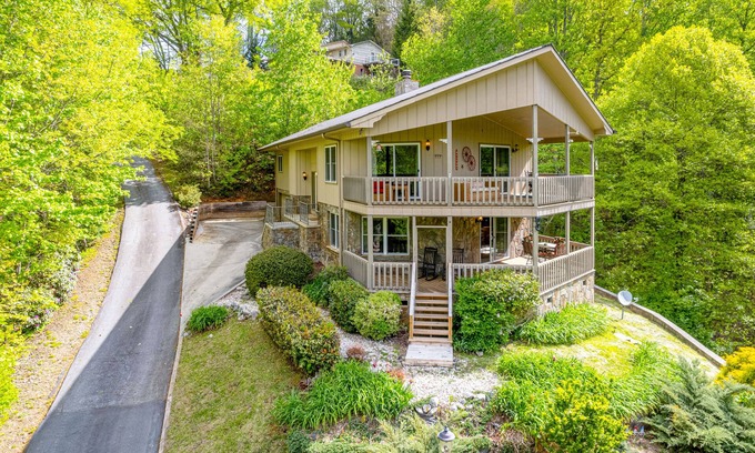 Franklin House | View-worthy home lined by trees with a fireplace, wrap-around deck, grill, & W/D