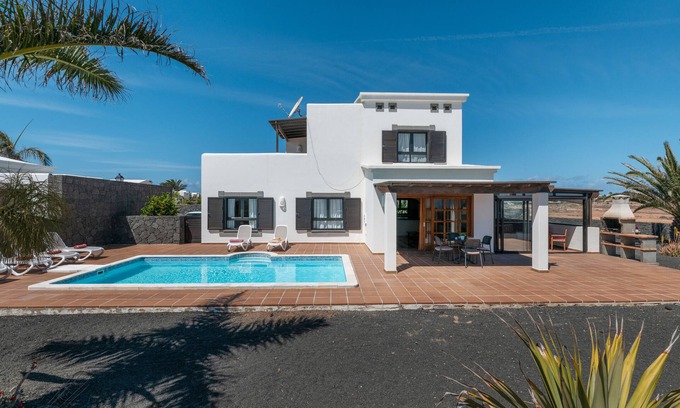 Playa Blanca Villa | 'Villa Ambar' with Mountain View, Sea View, Pool, Wi-Fi, Terraces & Garden