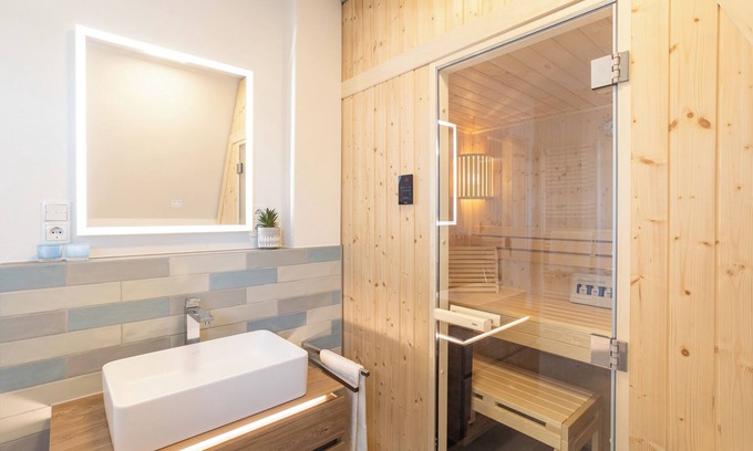 Timmendorfer Strand Apartment | Villa Dornkamp - a retreat under the roof. Sauna. Balcony. Stylish.