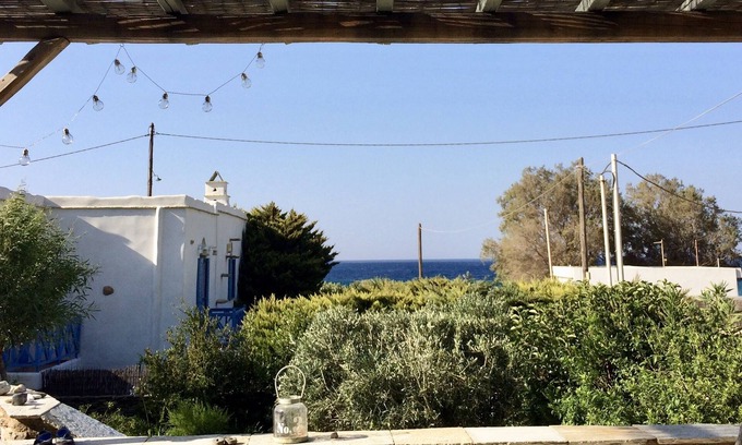 Exomvourgo House | Villa Elia - The charm of Tiniote architecture feet in the water!