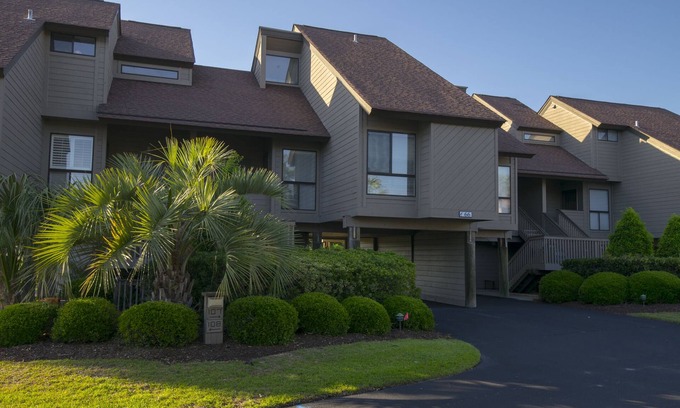 Litchfield by the Sea House | Villa with lake/marsh views and pool access located within gated Litchfield By the Sea community.