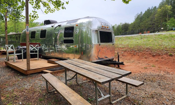 Mill Spring House | Vintage 1971 Airstream on the creek, easy access to pool and playground, sleeps 2.