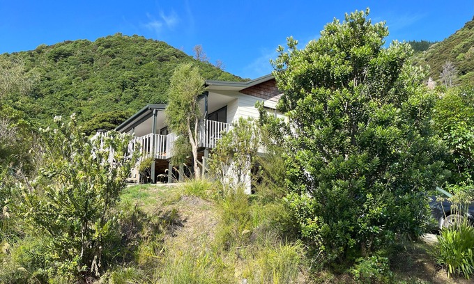 Waikawa Bay House | Waikawa Bay bach with spectacular harbour views and surrounded by native bush