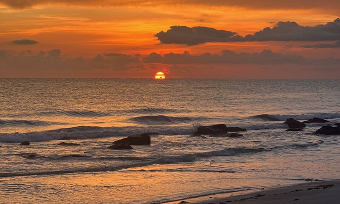 Sunset Reef Condo | Walk to restaurants on Redington Shores beach with wraparound porch.