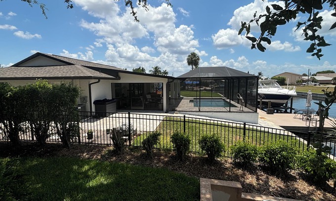Iona Shores House | Waterfront Canal Home. Boat Dock, Fishing, Heated Pool