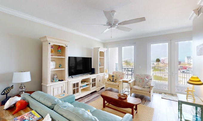 Mexico Beach Condo | Waterfront condo with pool, hot tub, furnished lanai, fireplace & chic furniture