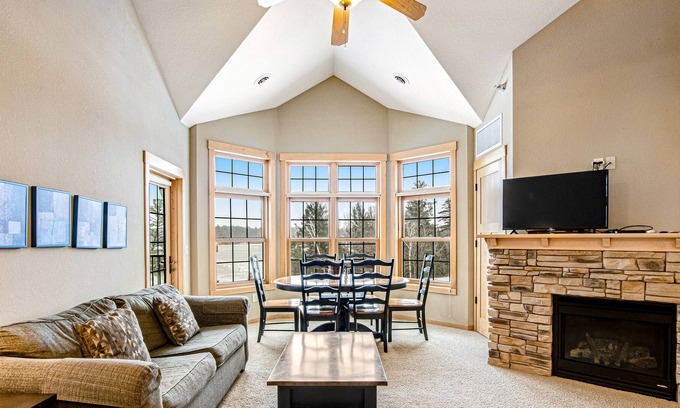 Three Lakes Condo | Waterfront condo with loft, washer/dryer, fireplace, balcony, pools, & hot tubs