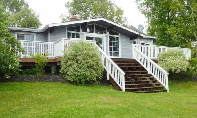 McMurrich/Monteith Cottage | Waterfront Cottage Large deck overlooks the lake