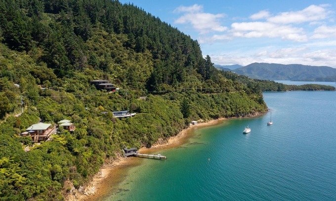 Whatamango Bay Cottage | Waterfront cottage nestled in native bush with epic views