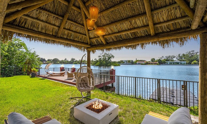Ojus House | Waterfront Jungle House, Firepit, Kayaks & Sunset