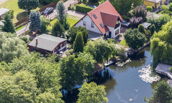 Schumachersiedlung House | Wonderful waterfront property directly on the Havel River with its own jetty and boat.