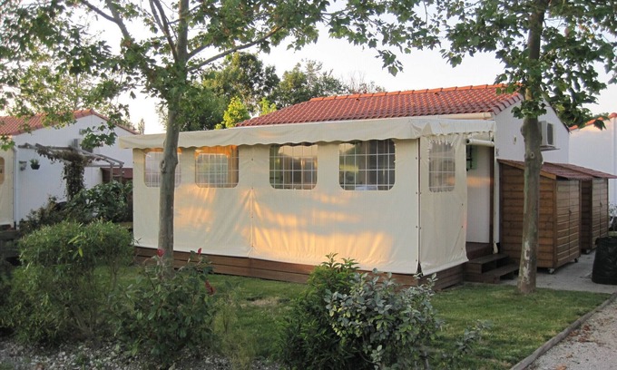 Saint-Pierre-d'Oleron Ski Chalet | wooden chalet in the gardens of St Pierre